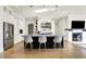 Spacious kitchen with a central island, stainless steel appliances, and modern pendant lighting at 565 Old Ashbury Rd, Westfield, IN 46074