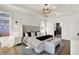 Spacious main bedroom with tray ceilings, pendant lighting, and an ensuite bathroom at 565 Old Ashbury Rd, Westfield, IN 46074