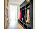 Functional mudroom with cubbies, bench, and coat storage, accented by a rustic sliding barn door at 565 Old Ashbury Rd, Westfield, IN 46074