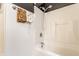 Clean bathroom featuring a shower/tub combo and black ceiling at 6189 Primrose Ave, Indianapolis, IN 46220