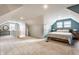 Spacious bedroom with a pitched ceiling, carpeted floors, and lots of natural light at 6189 Primrose Ave, Indianapolis, IN 46220