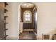 Charming entryway featuring arched doorways and a view of the front yard through a window at 6189 Primrose Ave, Indianapolis, IN 46220