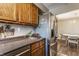 Open kitchen provides stainless steel refrigerator and plenty of counter space for meal preparation at 6189 Primrose Ave, Indianapolis, IN 46220