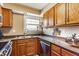 Functional kitchen offers stainless steel sink, neutral countertops, and ample cabinet space at 6189 Primrose Ave, Indianapolis, IN 46220