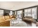 Open living room features abundant natural light, sliding glass doors, and comfortable seating at 6189 Primrose Ave, Indianapolis, IN 46220