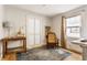 Well-lit office space with hardwood floors, large windows, and room for desk at 6189 Primrose Ave, Indianapolis, IN 46220
