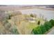 Areal photo showing the roof and pool of an estate surrounded by bare trees and farmland at 690 N 600 W, Lebanon, IN 46052