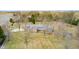 Stunning aerial view of a house with brick accents and a sprawling lawn surrounded by trees at 690 N 600 W, Lebanon, IN 46052