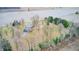 Wide aerial view of large gray house with a pool surrounded by barren trees and open land at 690 N 600 W, Lebanon, IN 46052