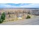 Areal view of a beautiful home with a large lawn, mature trees, and a scenic countryside backdrop at 690 N 600 W, Lebanon, IN 46052