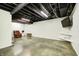 Spacious basement with painted floor and wall mounted TV at 690 N 600 W, Lebanon, IN 46052