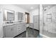 Modern bathroom with double vanity, marble countertops, and a glass-enclosed shower at 690 N 600 W, Lebanon, IN 46052