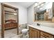 Bright bathroom featuring tiled accents and a connecting door to the bedroom at 690 N 600 W, Lebanon, IN 46052