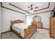 Bedroom featuring a tray ceiling and carved wood furniture set at 690 N 600 W, Lebanon, IN 46052