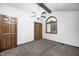 Carpeted bedroom features a ceiling fan and arched window at 690 N 600 W, Lebanon, IN 46052