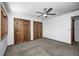 Spacious bedroom features plush carpet and a ceiling fan at 690 N 600 W, Lebanon, IN 46052