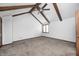 Bright bedroom featuring vaulted ceilings with exposed beams and neutral carpet at 690 N 600 W, Lebanon, IN 46052