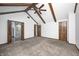 Spacious bedroom with vaulted ceilings, ceiling fan, and multiple entry doors at 690 N 600 W, Lebanon, IN 46052