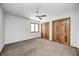 Bedroom with a ceiling fan, natural light, closet with wood doors, and neutral walls at 690 N 600 W, Lebanon, IN 46052