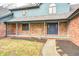 Inviting front porch with brick facade and a well-maintained lawn at 690 N 600 W, Lebanon, IN 46052