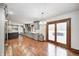 Modern kitchen connected to additional living spaces featuring sleek cabinetry, stainless steel appliances, and hardwood floors at 690 N 600 W, Lebanon, IN 46052