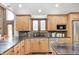 Stylish kitchen features granite counters, custom cabinets, and stainless steel appliances at 690 N 600 W, Lebanon, IN 46052