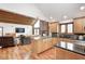 Open kitchen into the living room with an island and barstool seating at 690 N 600 W, Lebanon, IN 46052
