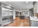 Modern kitchen featuring stainless steel appliances, sleek gray cabinetry, island and hardwood floors at 690 N 600 W, Lebanon, IN 46052