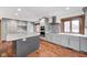 Modern gray kitchen featuring an island, stainless steel appliances, granite counters, and a stylish backsplash at 690 N 600 W, Lebanon, IN 46052