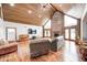 Open living room features wood paneled ceiling, fireplace, and abundant natural light at 690 N 600 W, Lebanon, IN 46052