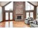 Cozy living room with a brick fireplace and large windows that provide ample natural light at 690 N 600 W, Lebanon, IN 46052