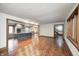 Open-concept living room showcasing hardwood floors, a kitchen island, and abundant natural light at 690 N 600 W, Lebanon, IN 46052