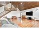 Open-concept living room with wooden floors and a staircase leading to the upper level at 690 N 600 W, Lebanon, IN 46052