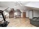 Loft area with wood floors, wood ceiling, and treadmill at 690 N 600 W, Lebanon, IN 46052