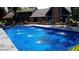A stunning in-ground pool with water features set against a backdrop of a beautiful two-story home at 690 N 600 W, Lebanon, IN 46052
