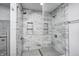 Close up of the shower showcasing the beautiful tile surround, dual shower heads and frameless glass at 690 N 600 W, Lebanon, IN 46052
