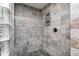 Close-up of a tiled walk-in shower with a built-in seat at 690 N 600 W, Lebanon, IN 46052