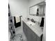 Bathroom vanity with granite countertop, new fixtures, and decorative lighting at 7406 E 33Rd St, Indianapolis, IN 46226