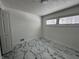 Cozy bedroom featuring marble floors and a large window at 7406 E 33Rd St, Indianapolis, IN 46226