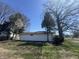 A view of the detached garage featuring neutral paint, a window, and a clear view of the sky at 7406 E 33Rd St, Indianapolis, IN 46226