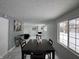 Bright living room features marble floors, a fireplace, and lots of natural light at 7406 E 33Rd St, Indianapolis, IN 46226