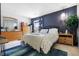 Spacious bedroom featuring dark blue walls and coordinated furniture at 7779 Harbour # 51, Indianapolis, IN 46240