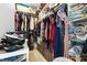 This walk-in closet offers ample storage with organized shelving and hanging space for clothing and accessories at 7779 Harbour # 51, Indianapolis, IN 46240