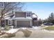 Charming townhouse exterior with a two-car garage, beautiful siding, and a paved driveway at 7779 Harbour # 51, Indianapolis, IN 46240