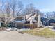Charming townhome with attached garage, inviting entrance, and well-maintained landscaping on a sunny day at 7779 Harbour # 51, Indianapolis, IN 46240