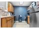 Functional kitchen with wooden cabinets, modern appliances, and convenient layout for cooking at 7779 Harbour # 51, Indianapolis, IN 46240