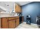 Functional kitchen with wooden cabinets, modern appliances, and convenient layout for cooking at 7779 Harbour # 51, Indianapolis, IN 46240