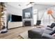 Inviting living room with a fireplace, vaulted ceiling, lots of natural light, and modern decor at 7779 Harbour # 51, Indianapolis, IN 46240