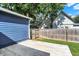 A backyard with a green lawn, a wood deck, and a wood fence surrounding the yard at 790 N 14Th St, Noblesville, IN 46060