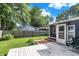 A backyard with a green lawn, a wood deck, and a wood fence surrounding the yard at 790 N 14Th St, Noblesville, IN 46060